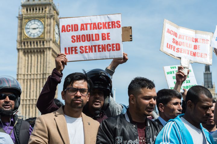 Hundreds of motorcycle drivers gather in Parliament Square in central London to protest against acid attacks and motorcycle theft, July 18.