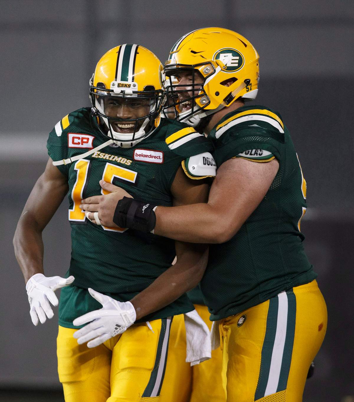 Edmonton Eskimos Vidal Hazelton (15) and David Beard (57) celebrate a touchdown against the Hamilton Tiger-Cats during second half CFL action in Edmonton, Alta., on Friday August 4, 2017. 