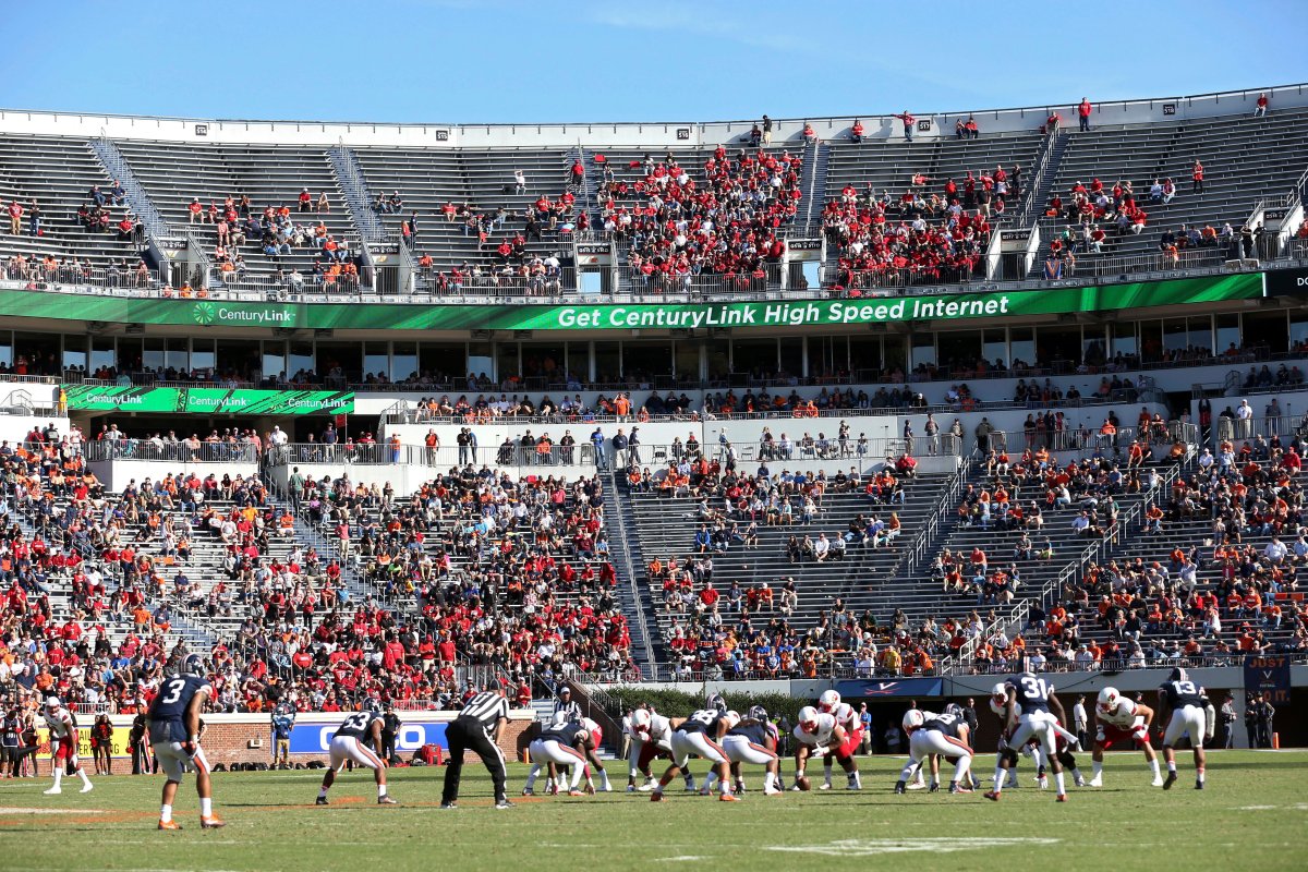 In this Oct. 29, 2016, file photo, Louisville lines up for a play against Virginia during an NCAA college football game in Charlottesville, Va. ESPN broadcaster Robert Lee will not work VirginiaÄôs season opener because of recent violence in Charlottesville sparked by the decision to remove a statue of Confederate Gen. Robert E. Lee.