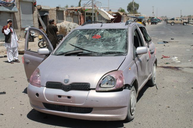 Afghan security officials inspect the scene of a previous bomb attack in Helmand province, Afghanistan, 23 August 2017. 

