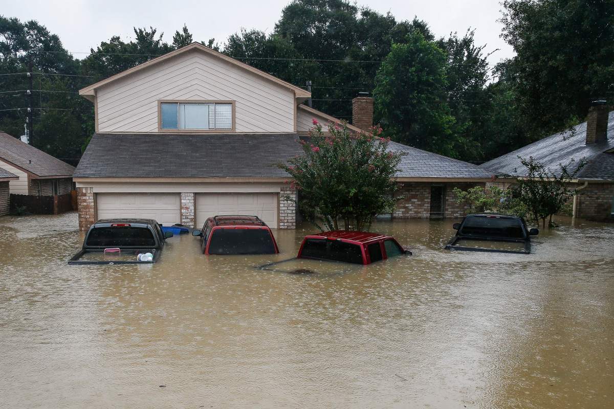 Trucks are submerged on Pine Cliff Drive as Addicks Reservoir nears capacity due to near constant rain from Tropical Storm Harvey Tuesday, Aug. 29, 2017 in Houston.