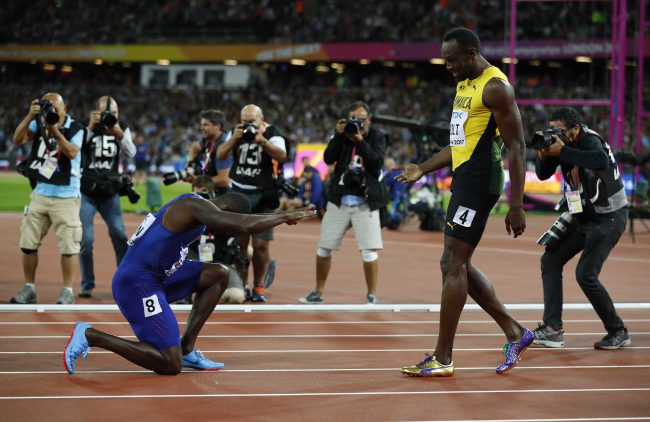 Justin Gatlin of the U.S. salutes Usain Bolt of Jamaica after the men's 100-metre final at the World Athletics Championships in London Stadium, London, Britain, Aug. 5, 2017.