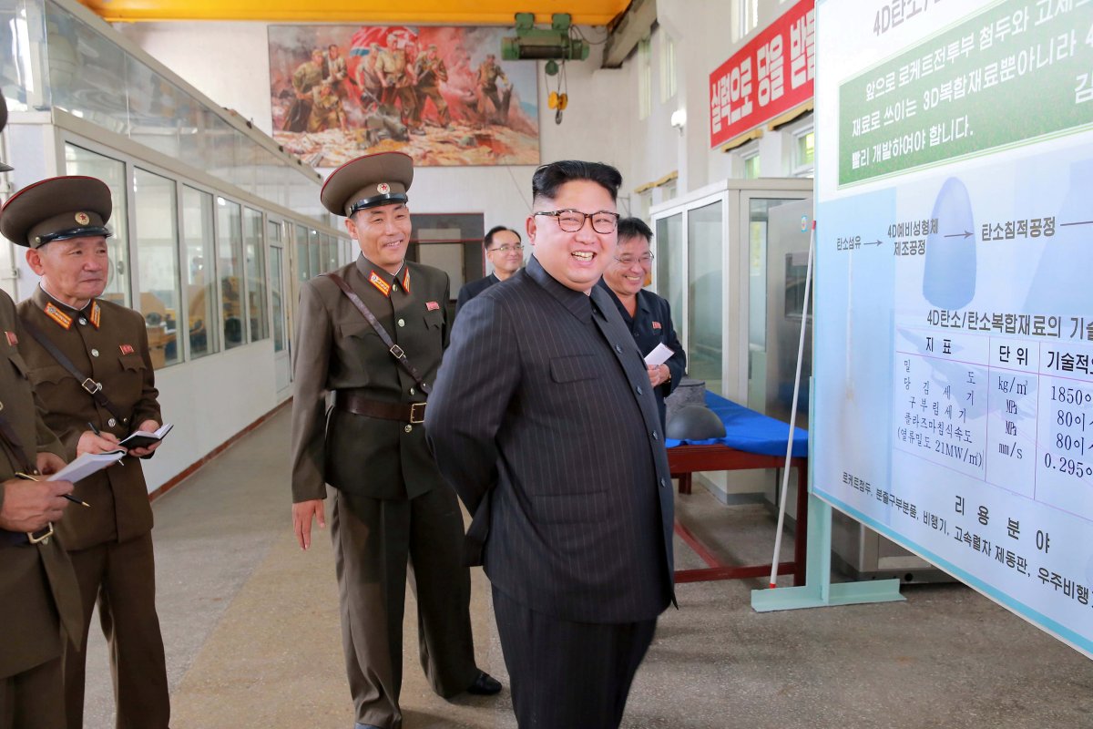 North Korean leader Kim Jong-Un smiles during a visit to the Chemical Material Institute of the Academy of Defense Science in this undated photo released by North Korea's Korean Central News Agency (KCNA) in Pyongyang on August23, 2017.  