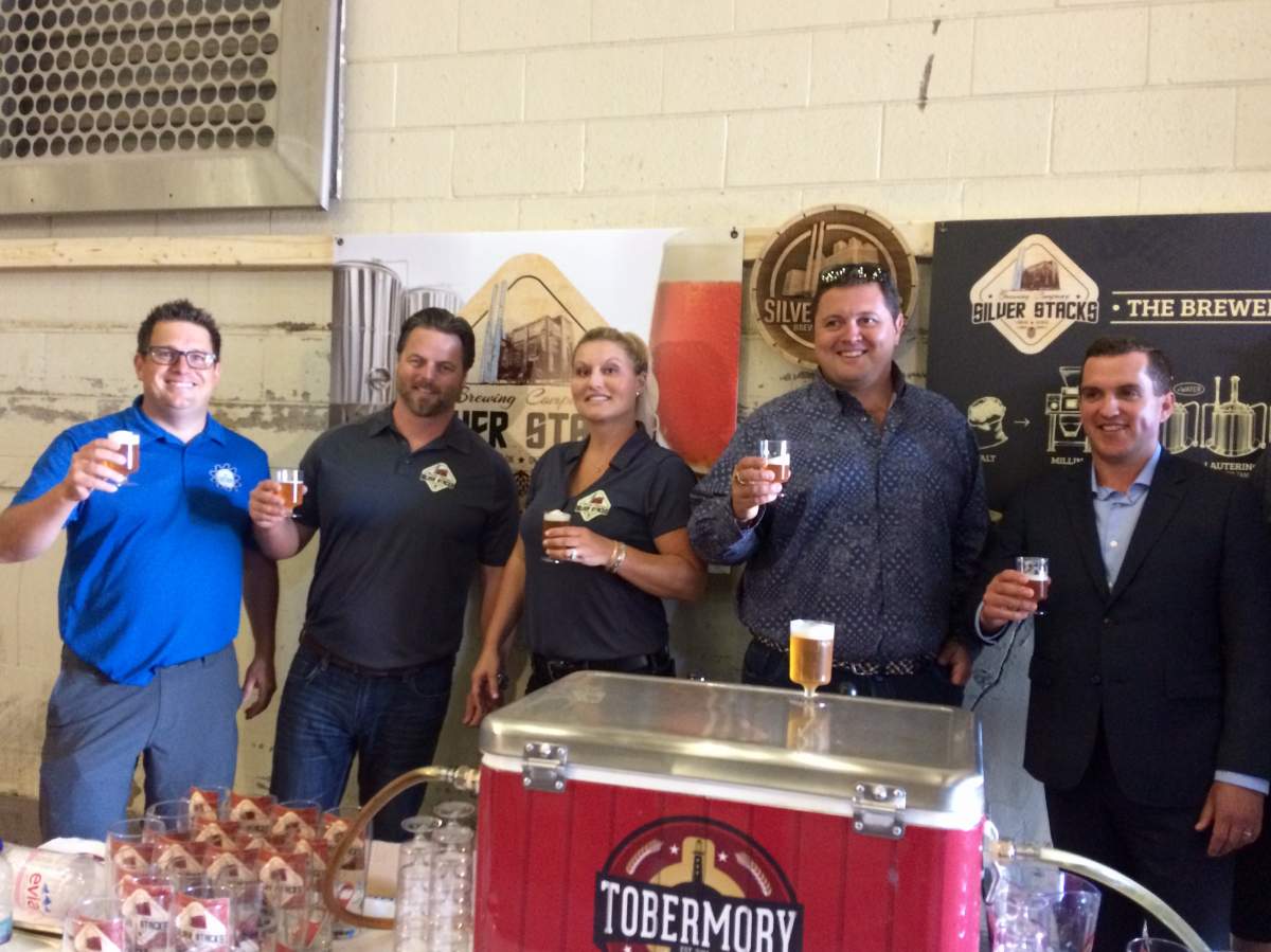 From left to right: Dan Cassidy, General Manager of The Factory; Matthew Buckley, co-owner of Silverstacks Brewing Company; Kristin Buckley, co-owner of Silverstacks Brewing Company; Paul McLaughlin, owner of 100 Kellogg Lane; Kris Dinel, Media Relations with E&E McLaughlin Ltd.