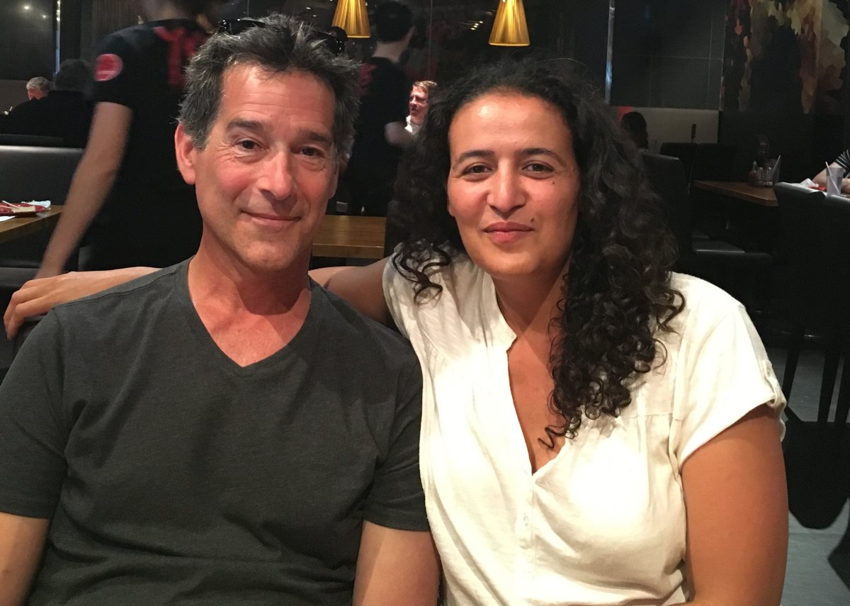 Amal Asmar sits with her husband, husband Ellis Galbraith. Asmar was a victim of racial and social profiling while sitting on a bench in Montreal in 2010.