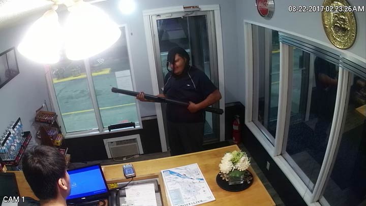 Battlefords RCMP have released surveillance photos in an attempt to identify a man who tried to rob a business armed with a projector screen on Tuesday.