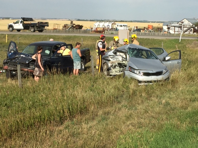 Emergency crews at the scene of a two vehicle crash on Highway 566 Sunday. 