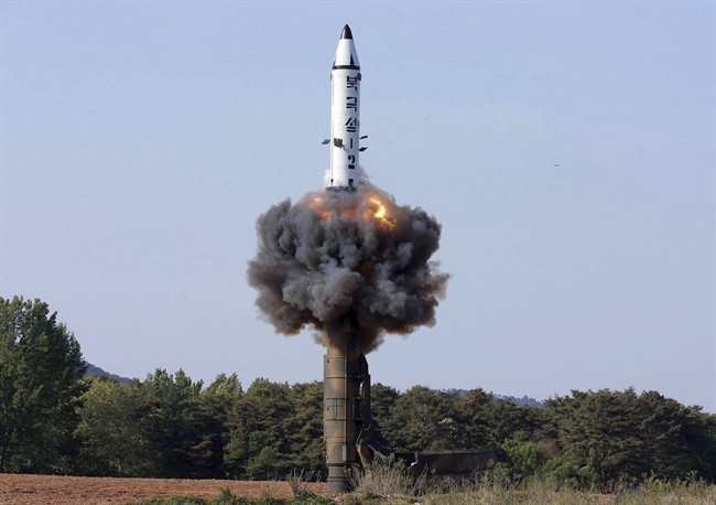 In this undated file photo distributed by the North Korean government on May 22, 2017, a solid-fuel “Pukguksong-2” missile lifts off during its launch test at an undisclosed location in North Korea.