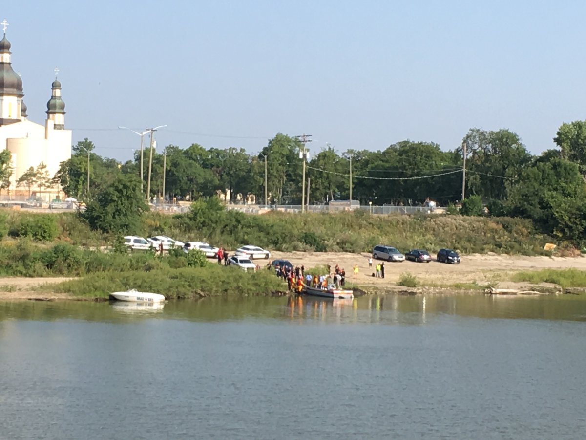 The scene where a body was discovered in the Red River Friday morning. 