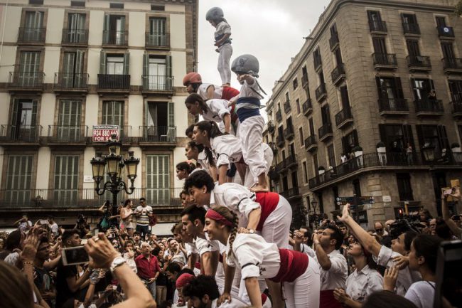 A human tower built at the site of a memorial to honour victims of the vehicle attack in Las Ramblas promenade, Barcelona, Spain, Aug. 19, 2017.
