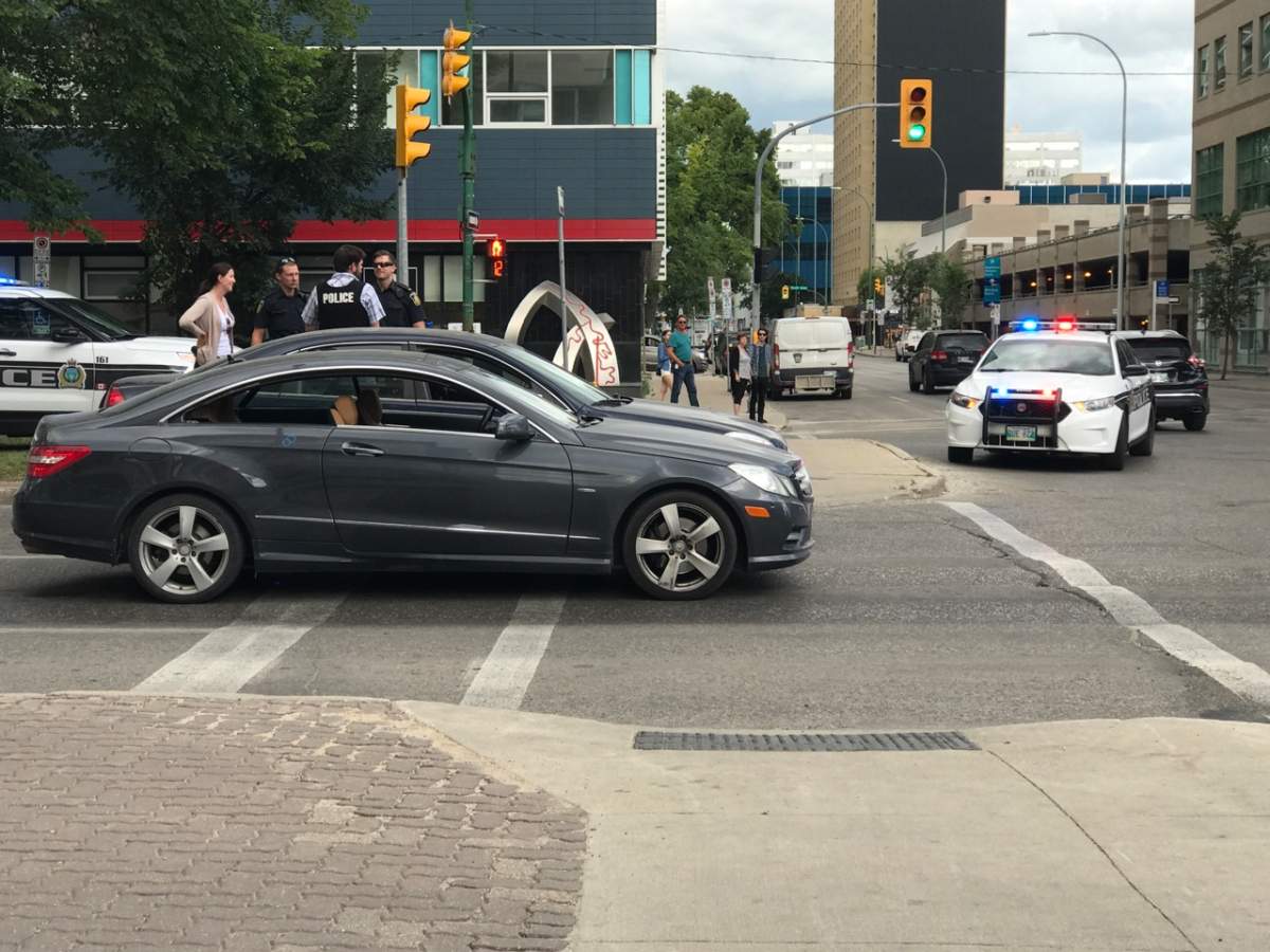 Officers arrest Matthew Glenn Wegier after he forced a man to drive down Broadway at gunpoint. 