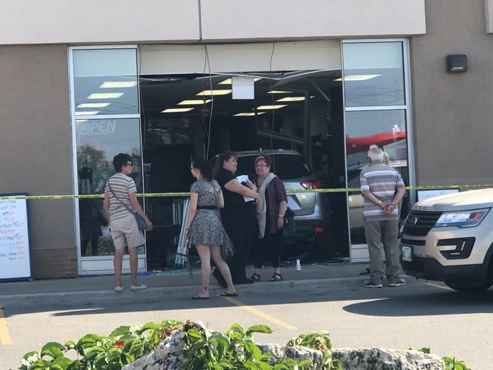 Submitted photos show an SUV that drove into a Winnipeg hair salon Friday. 