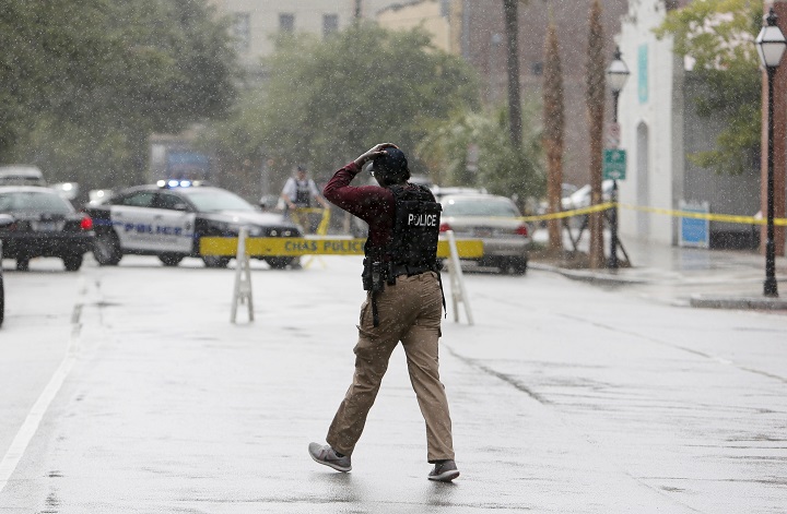 Charleston, S.C. Police Department blocks the street during an active hostage situation in Charleston, S.C., on Thursday, Aug.24, 2017.  Authorities say a disgruntled former employee shot one person and held hostages in a restaurant in an area that is popular with tourists, before being shot by police.