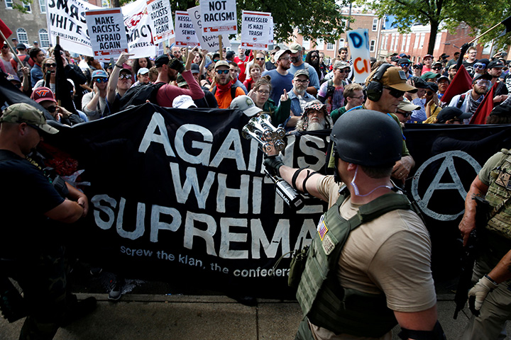  Members of white nationalists are met by a group of counter-protesters in Charlottesville, Virginia, August 12, 2017.   