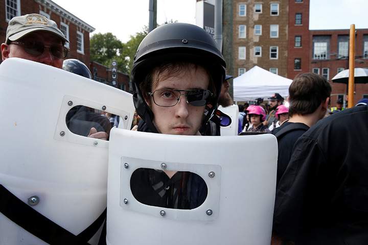 Members of white nationalists clash against a group of counter-protesters in Charlottesville, Virginia, August 12, 2017.
