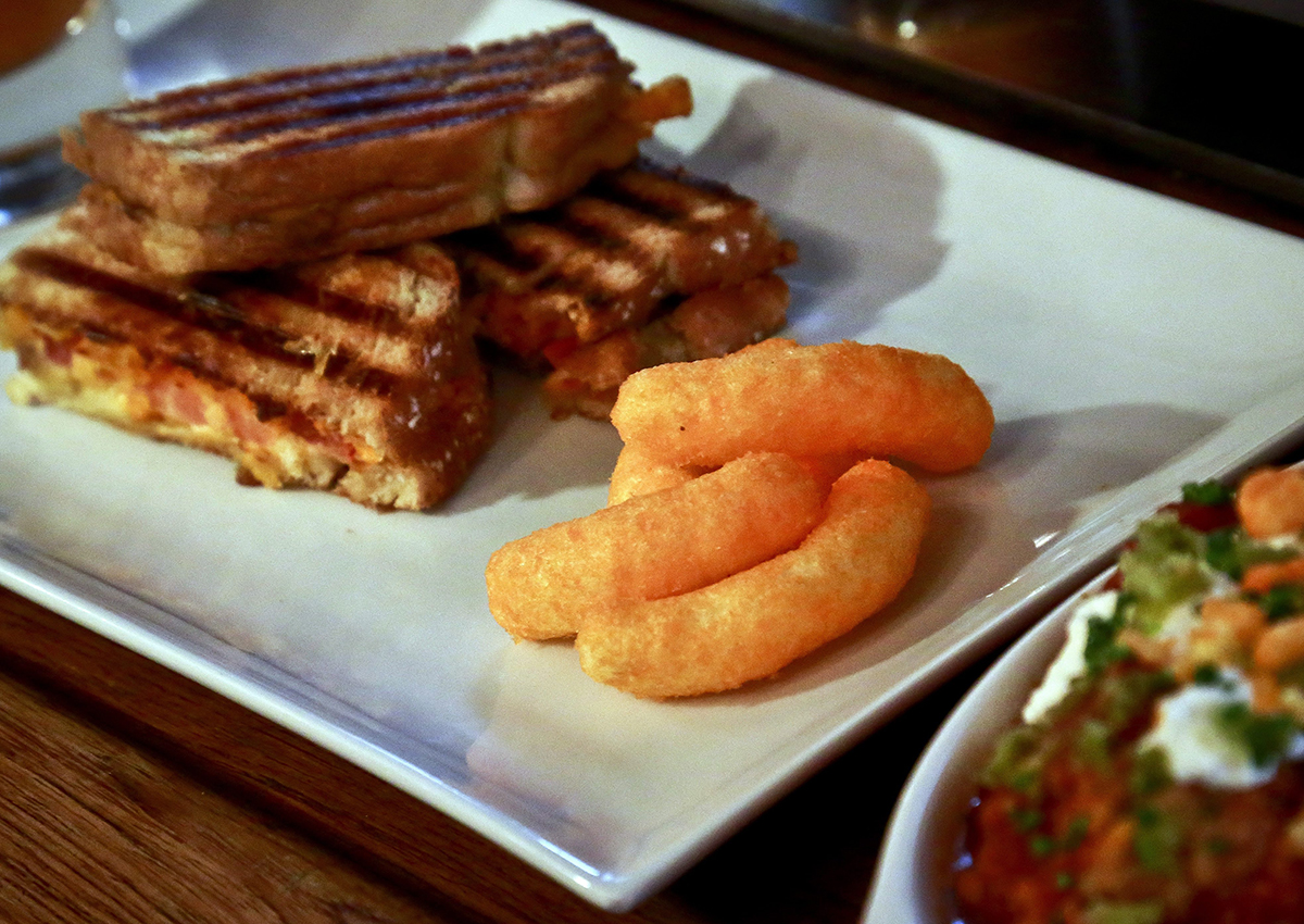 A grill cheese made with Cheetos is shown during a press preview for a three-day pop-up restaurant featuring an all-Cheetos menu, Tuesday Aug. 15, 2017, in New York.