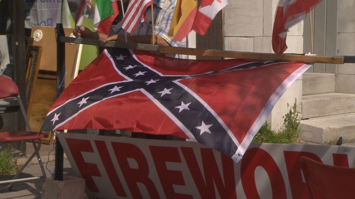 The Confederate flag waves just outside the Agora flag shop on Parc Avenue. Monday August 14, 2017.  