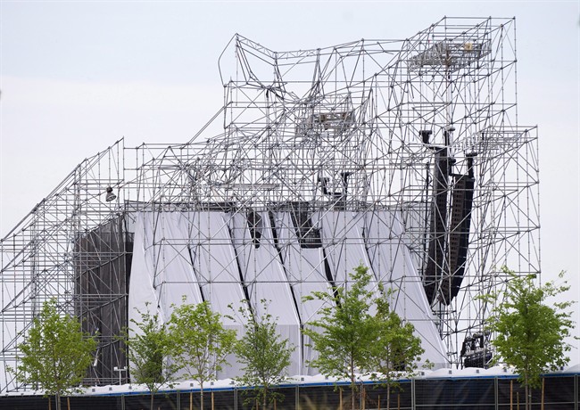 A collapsed stage is shown at a Radiohead concert at Downsview Park in Toronto on June 16, 2012. Lawyers for an entertainment company and an engineer accused in a deadly 2012 stage collapse at an outdoor Radiohead concert in Toronto are asking an Ontario court to stay the charges against them. The entertainment company Live Nation and an engineer, Domenic Cugliari, are arguing the case has seen unreasonable delays that violate their right to a timely trial. 