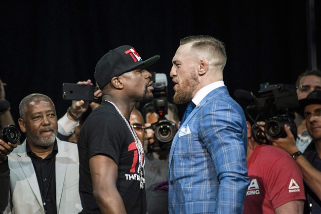 Floyd Mayweather, left, and Conor McGregor while on a promotional tour stop in Toronto on July 12, 2017. They were promoting their upcoming boxing match in Las Vegas, happening on August 26.