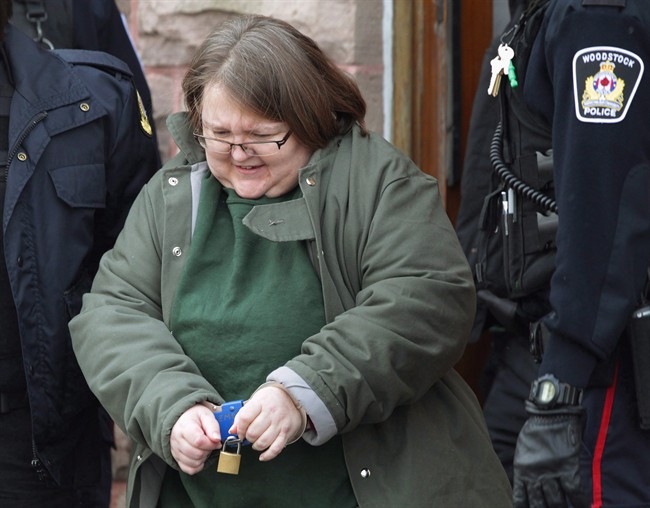 Elizabeth Wettlaufer is escorted from the courthouse in Woodstock, Ont., on Friday, Jan. 13, 2017.