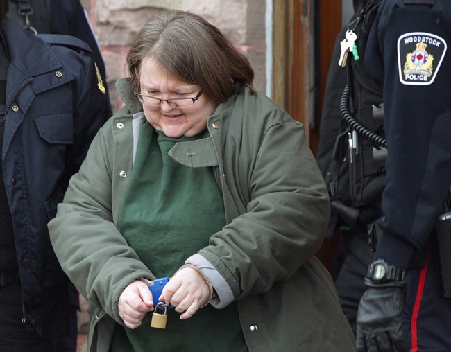 Elizabeth Wettlaufer is escorted from the courthouse in Woodstock, Ont., on Friday, Jan. 13, 2017. 