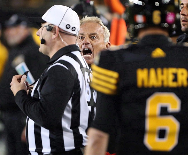 Jeff Reinebold yells at a referee following an attempted on-side kick by the Hamilton Tiger-Cats against the Edmonton Eskimos on October 28, 2016. The winless Ticats shook up their coaching staff on Tuesday by replacing defensive co-ordinator Reinebold.