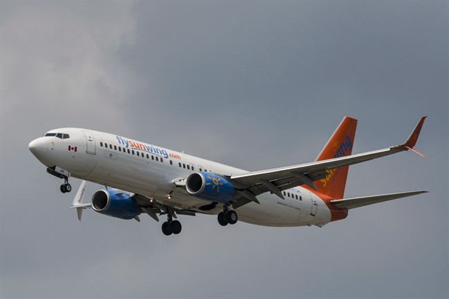 A Sunwing Boeing 737-800 passenger plane prepares to land at Pearson International Airport in Toronto on Wednesday, August 2, 2017.
