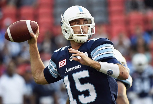 Toronto Argonauts quarterback Ricky Ray (15) passes against the Calgary Stampeders during first half CFL football action in Toronto on Thursday, August 3, 2017.