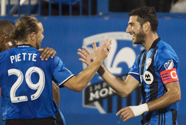 Montreal Impact's Ignacio Piatti, right, celebrates with teammate Samuel Piette.