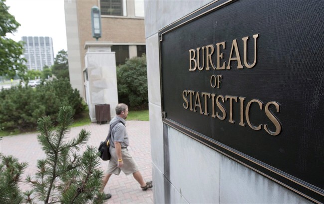 An employee makes his way to work at Statistics Canada, in Ottawa in a July 21, 2010, file photo. 