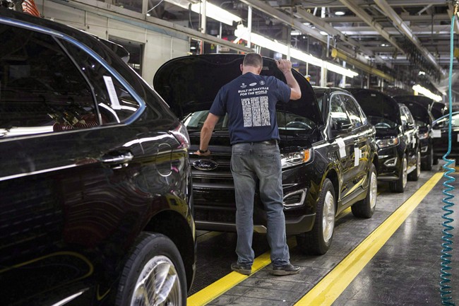 New Ford Edges sit on a production line as Ford Motor Company celebrates the global production start of the 2015 Ford Edge at the Ford Assembly Plant in Oakville, Ont., on Thursday, February 26, 2015.