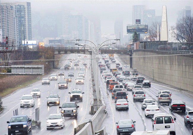 Vehicles make their way into and out of downtown Toronto along the Gardiner Expressway in Toronto on Nov. 24, 2016.