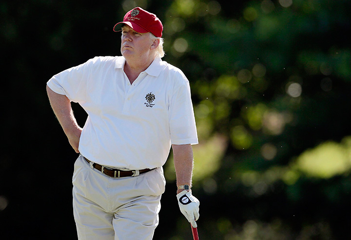 In this June 27, 2012, file photo, Donald Trump stands on the 14th fairway at Congressional Country Club in Bethesda, Md. 