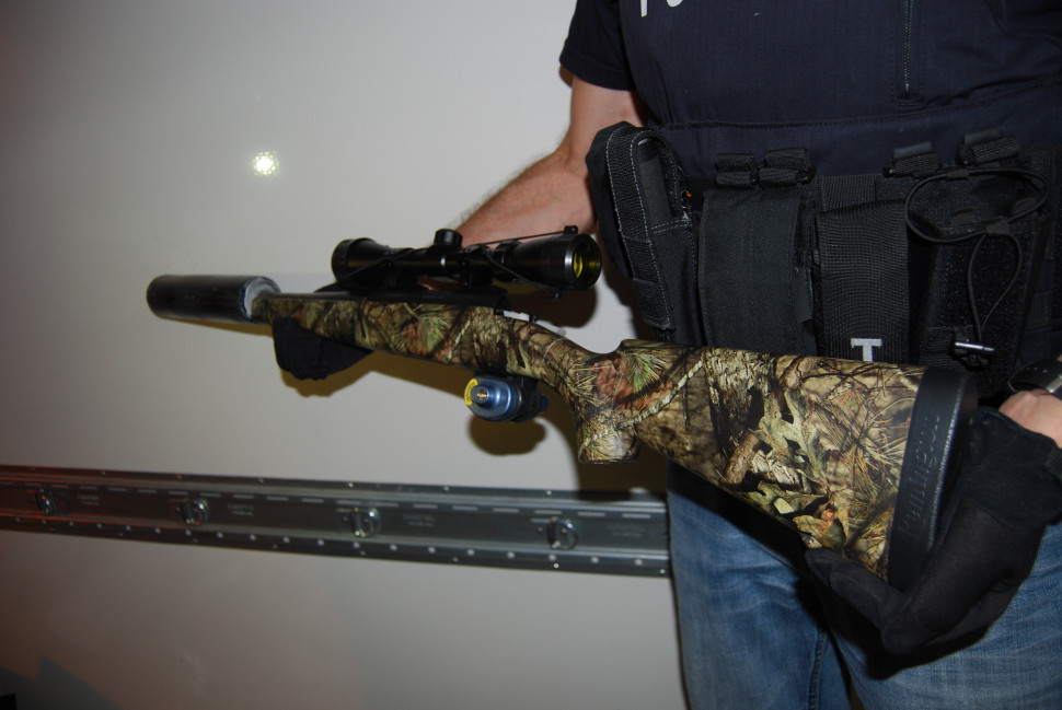 A silenced rifle was seized during the investigation by New Brunswick RCMP