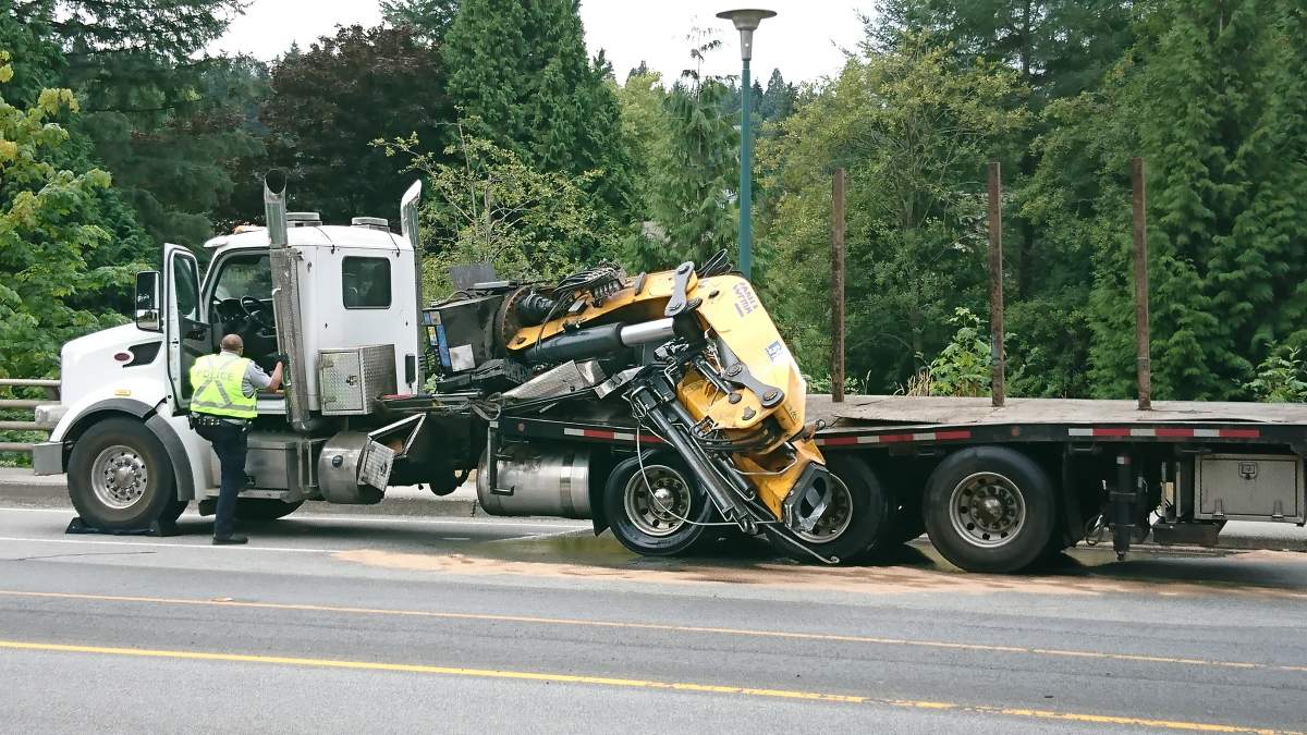 The semi carrying a crane hit an overpass in Coquitlam.