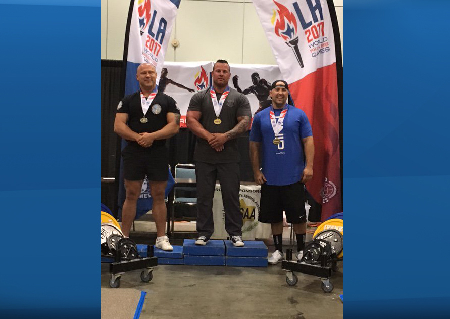 Cst. Potter seen after winning gold in the Bench Press competition at the 2017 World Police and Fire Games.