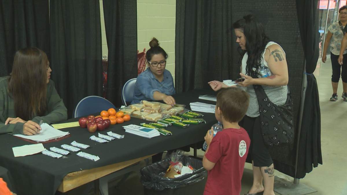 Regina Treaty/Status Indian Services booth at Queen City Ex helping people who need food, water or advice.