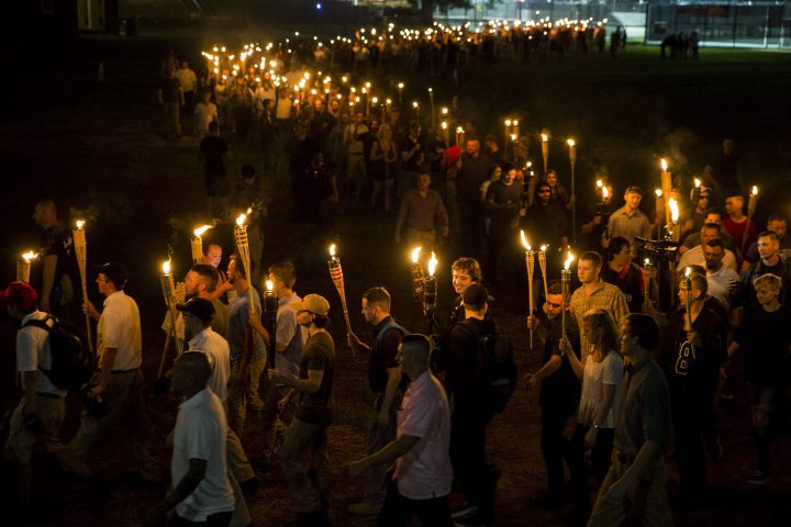 White supremacists march through the University of Virginia campus in Charlottesville, Va., on August 11, 2017.