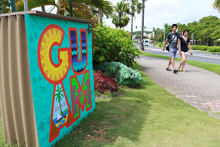 In this May 15, 2017 file photo, tourists walk through a shopping district in Tamuning, Guam.