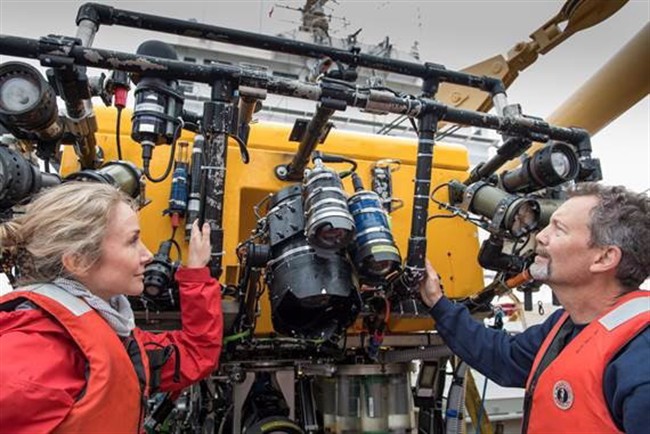 Onboard the Martha L. Black, Robert Rangeley (right), Director of Science at Oceana Canada and Alexandra Cousteau, Senior Oceana Advisor, inspect the ROPOS after a dive. 
