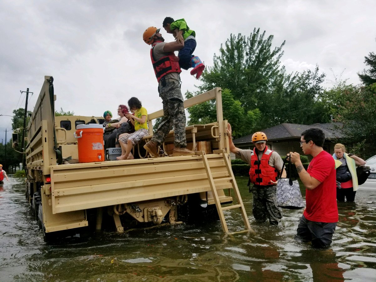 Texas National Guard soldiers aid residents in heavily flooded areas from the storms of Hurricane Harvey in Houston, Texas, U.S., August 27, 2017       Lt. Zachary West, 100th MPAD/Texas Military Department/Handout via REUTERS   .