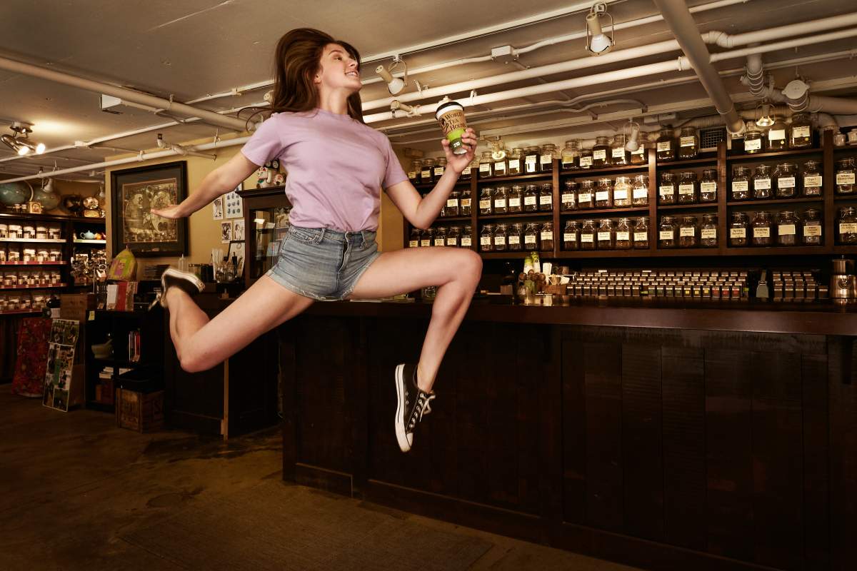 A dancer takes a leap in the air at World Tea House in Halifax.