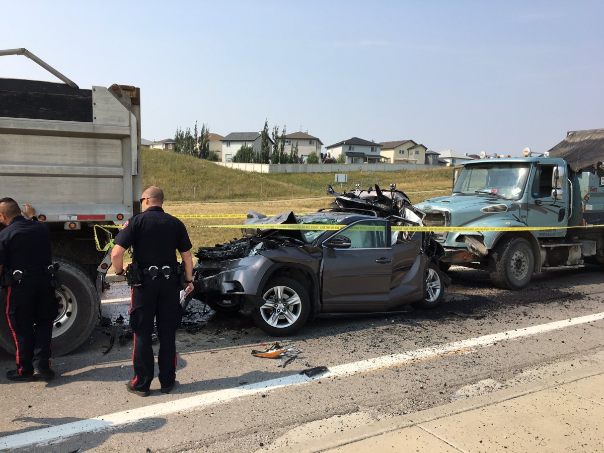 An SUV was sandwiched between two dump trucks in a crash that sent two people to hospital on Thursday morning. 