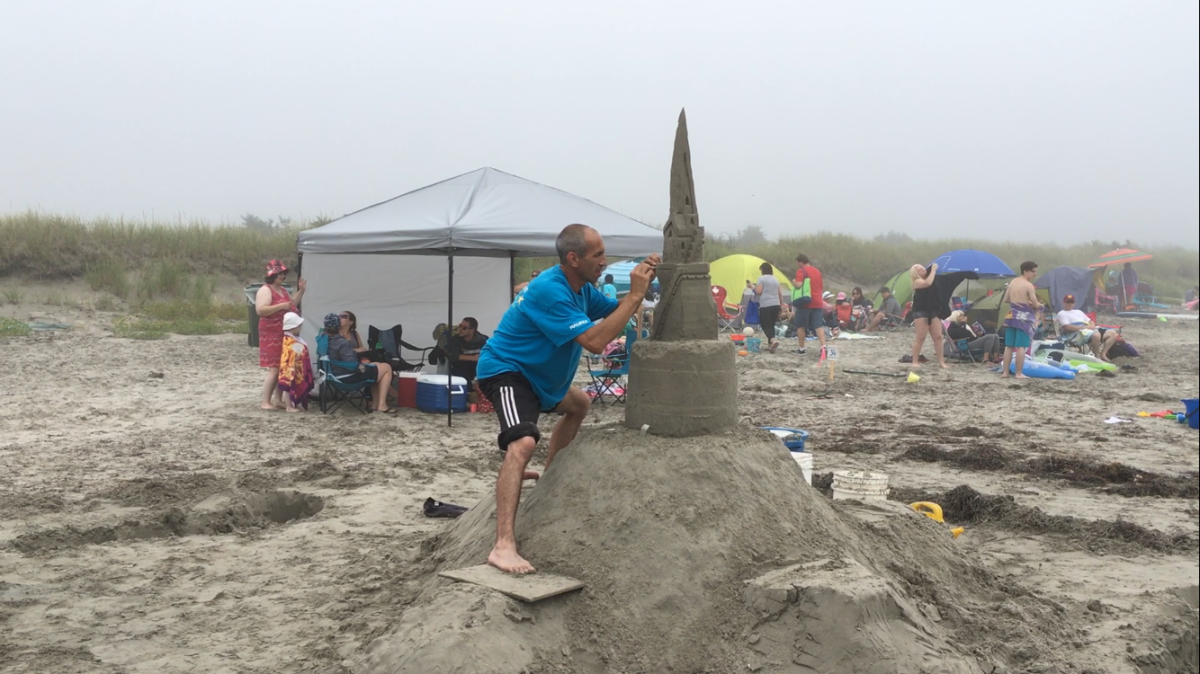 Shawn Gayton says every minute counts when creating his sandcastle.