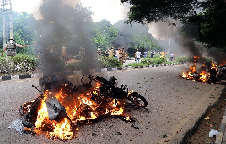 Vehicles set on fire by suspected Dera Sacha Sauda sect members during riots in Panchkula, India on Aug. 25, 2017, after an Indian court convicted self-styled guru and spiritual leader Gurmeet Ram Rahim Singh for raping two of his followers.
