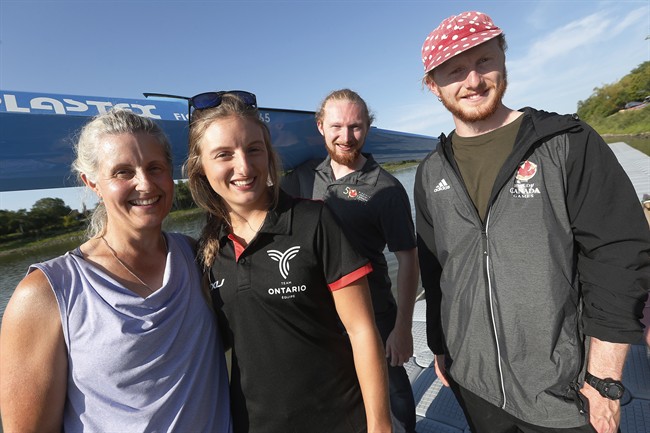 Members of the Vincent family, from left, Fiona, Lexy, Kenzie and Fearghus (father Mike is missing) carry their boats beside the Red River at the Manitoba Canoe and Kayak Centre, home of the Canada Games races, Sunday, August 6, 2017. Kayaking runs deep in the Vincent family at this summer's Canada Games and beyond.
