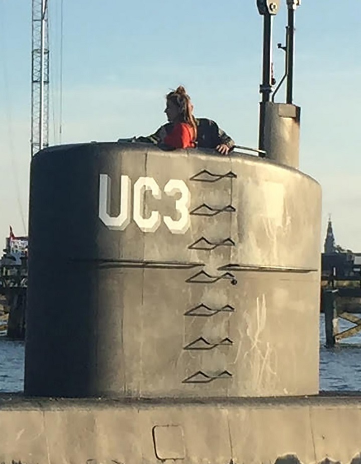 This photo shows Swedish journalist Kim Wall standing in the tower of the private submarine “UC3 Nautilus” on August 10, 2017 in Copenhagen Harbour.  She has not been seen since.