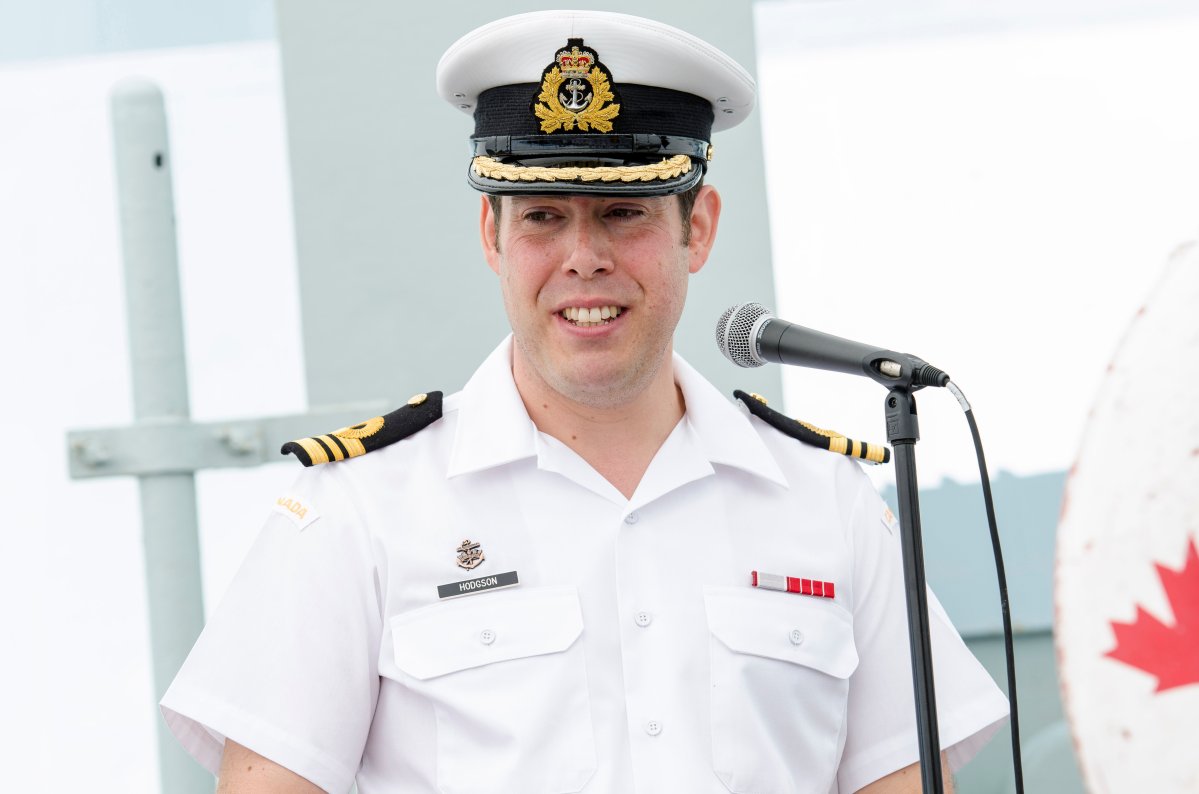 Lieutenant-Commander Russel Hodgson addresses the crew and guests on-board HMCS Moncton.