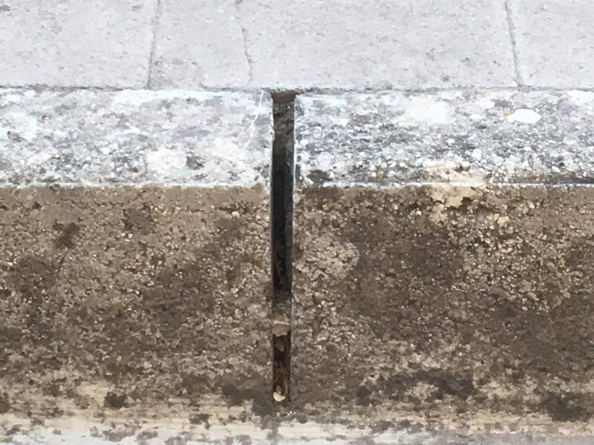 The crack in the sidewalk where Justin spotted his wife’s lost engagement ring.
