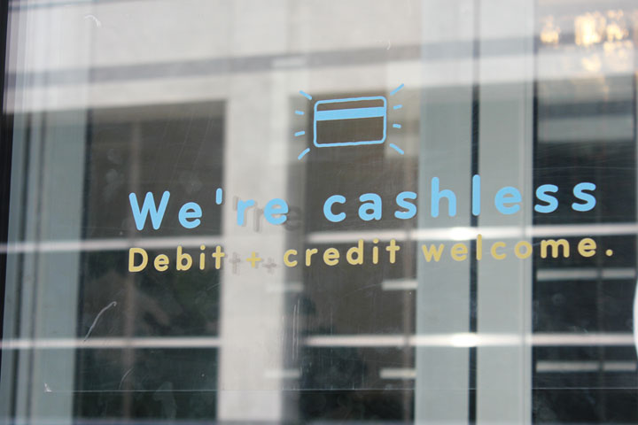 “We’re cashless!” reads a sign on the door of a Mad Radish location in Ottawa.